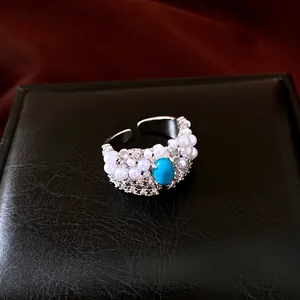 Vintage silver-toned open ring with turquoise, pearls, and sparkling zircons