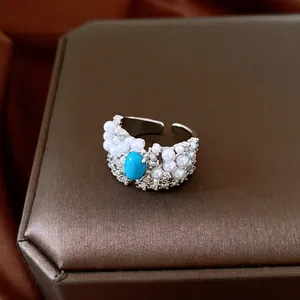 Exquisite vintage silver open ring with pearls, sparkling zircons and a turquoise stone