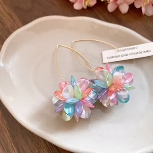 Close-up detail of sweet multi-color flower ball drop earrings for beach vacation