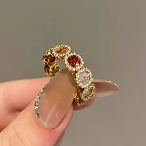 Elegant close-up detail of 14k gold plated ring with multi-colored square zircons