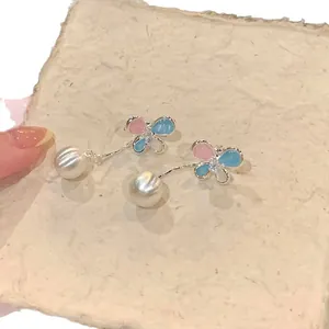 Elegant butterfly earrings with colorful enamel and dangling pearl tassels