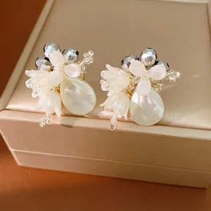 Luxury shell flower stud earrings featuring elegant pearlescent teardrop dangles for women