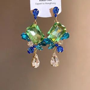 Elegant vintage silver needle drop earrings with large emerald green square crystals