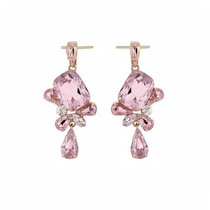 Elegant rose gold drop earrings featuring faceted mixed pink crystals on a clean white background.