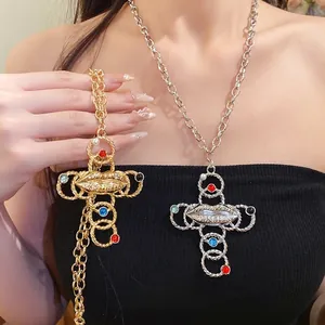 Vintage cross necklace with lip design and resin pearls in gold and silver finish