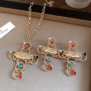 Elegant vintage gold cross necklace with lip charm and colorful resin pearls for women