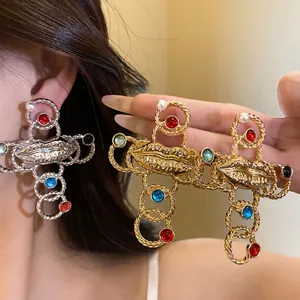 Elegant retro baroque style cross necklace featuring lip motifs and colorful resin