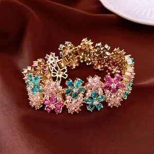 Detailed view of 18k gold plated flower bracelet with colorful sparkling zircons