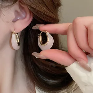 Detailed view of U-shaped jelly resin hoop earrings in a minimalist Korean style