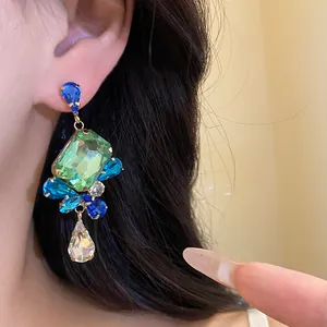 Detailed view of vintage square drop earrings featuring vibrant colorful rhinestones.