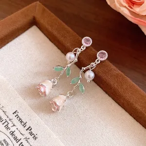 Elegant rose drop earrings with S925 silver needles, pink zircons, and white pearls.