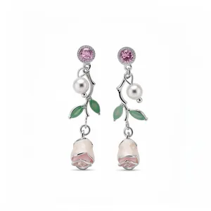 Elegant floral dangle earrings with pink zircon, pearl, and detailed rose bud design.