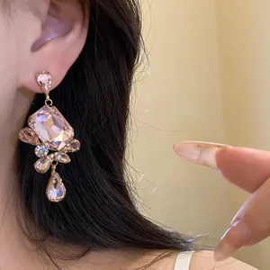 Detailed view of vintage pink crystal dangle earrings with square faceted stone