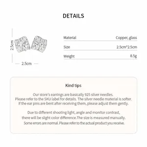 Dettaglio ravvicinato di orecchini a rombo color argento con vetro e specifiche