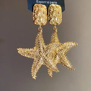 Elegant vintage textured golden starfish drop earrings with luxury matte finish for women