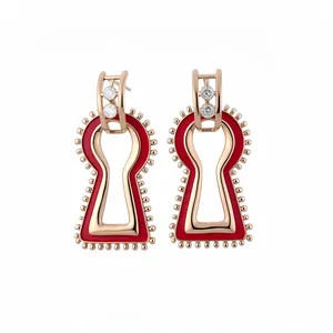 Vintage palace style gold geometric keyhole drop earrings with red enamel and crystals