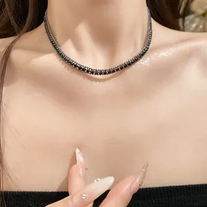 Detailed close-up of a sparkling black double-strand tennis choker necklace on elegant neck