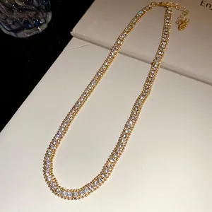 Detail view of a luxury double-row crystal choker necklace with gold-tone plating
