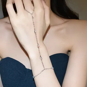 Detailed view of a silver harness bracelet featuring zircon star accents.