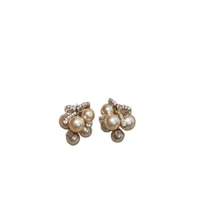 Elegant pearl cluster stud earrings with zircon bow accent for women's fashion jewelry