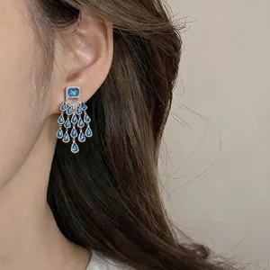 Luxury vintage silver needle chandelier earrings with blue teardrop rhinestone inlay