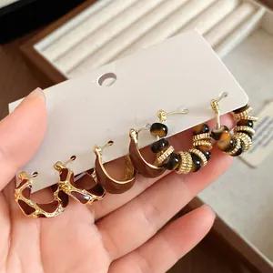 Detailed view of vintage palace style 6-piece earring set with resin and gold finish