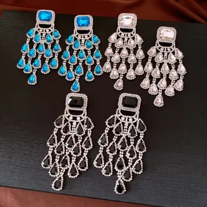 Detail shot of vintage-style chandelier earrings with teardrop rhinestones.