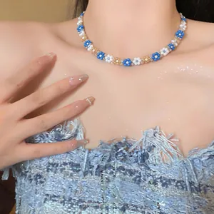 Detailed close-up showing a stylish blue and white flower beaded choker necklace
