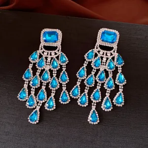 Elegant vintage silver earrings featuring square and teardrop blue stones with rhinestones