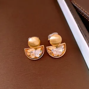 French vintage semi-circle clip-on earrings featuring inlaid crystals with a brushed gold finish