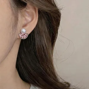 French vintage pink crystal semicircular earrings with pearl detail shown on model