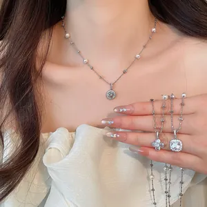 Detailed close-up showing elegant flower and geometric zircon pearl necklaces on a model.