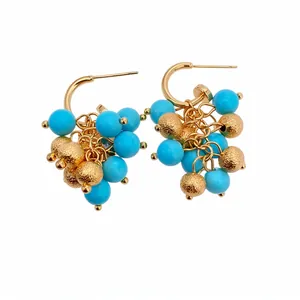 Elegant 18k gold plated hoop earrings featuring blue resin beads and textured spheres