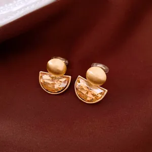 Detailed view of French vintage semi-circular crystal clip-on earrings with gold finish