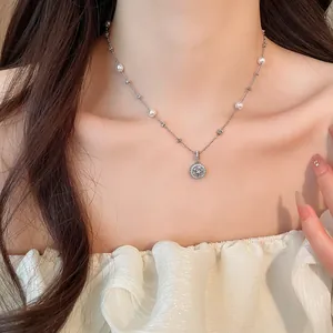 Elegant Korean style necklace with artificial pearls and cubic zircon pendant on model neck