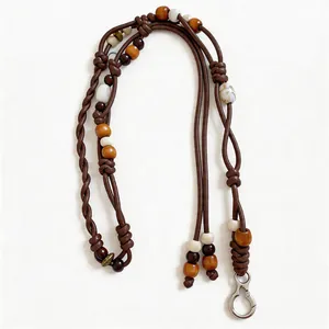 Retro ethnic style leather cord and wooden bead waist chain for women on white background