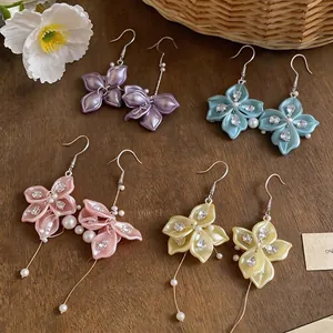 Elegant Korean-style petal drop earrings with zircon accents and pearl tassels in four colors