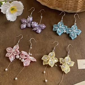 Multi-color flower petal drop earrings with sparkling zircon and pearl tassels on wood