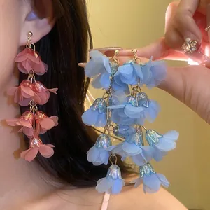 Bohemian style long cascading fabric flower drop earrings for a romantic beach vacation.