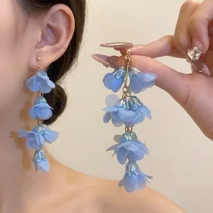 Bohemian style light blue fabric flower tiered dangle earrings with gold-tone accents