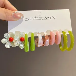 Detail view of 5-pair resin earring set featuring floral and geometric dopamine designs.