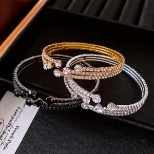 Vintage crystal encrusted elastic open cuff bracelets in gold, silver and black colors.