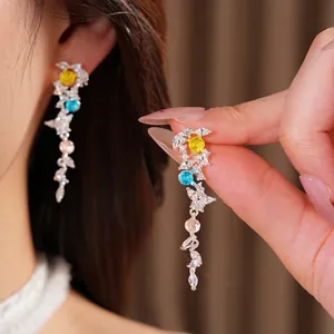 Elegant silver needle earrings featuring cubic zirconia and colorful stone leaf tassel charms