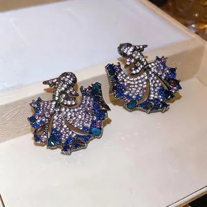 Vintage koi fish stud earrings with sparkling purple and blue zircons