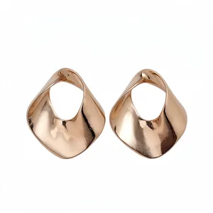 Stylish modern twisted rose gold geometric hollow earrings featuring a polished metallic finish