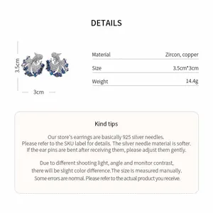 Detail view of zircon koi fish earrings with size, weight, and material specifications