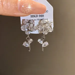 Exquisite 14k gold plated flower clip-on earrings featuring brilliant zircon stones