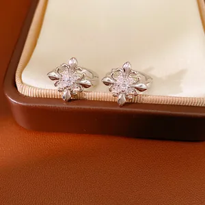 Detail showing the intricate fleur-de-lis and cross design set with cubic zirconia stones