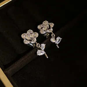 Detailed view of elegant 14k gold plated cubic zirconia flower clip-on earrings