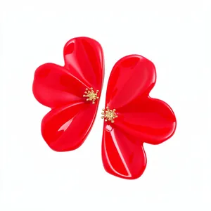 Elegant large red resin flower stud earrings with golden centers on white background